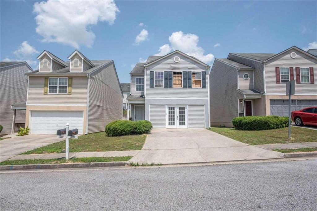Investors! Fire has damaged the 2nd floor of this adorable 3BR 2.5BA home, but the opportunity to repair and gain equity is what you're here for! The main level consists of kitchen, dining area, living room, half bath, and a converted garage with double doors for extra entertainment space. Upstairs are three bedrooms including the owner's suite and two guest rooms that share a full bath. Reap the benefits of owning in this tidy neighborhood convenient to the airport and downtown Atlanta.