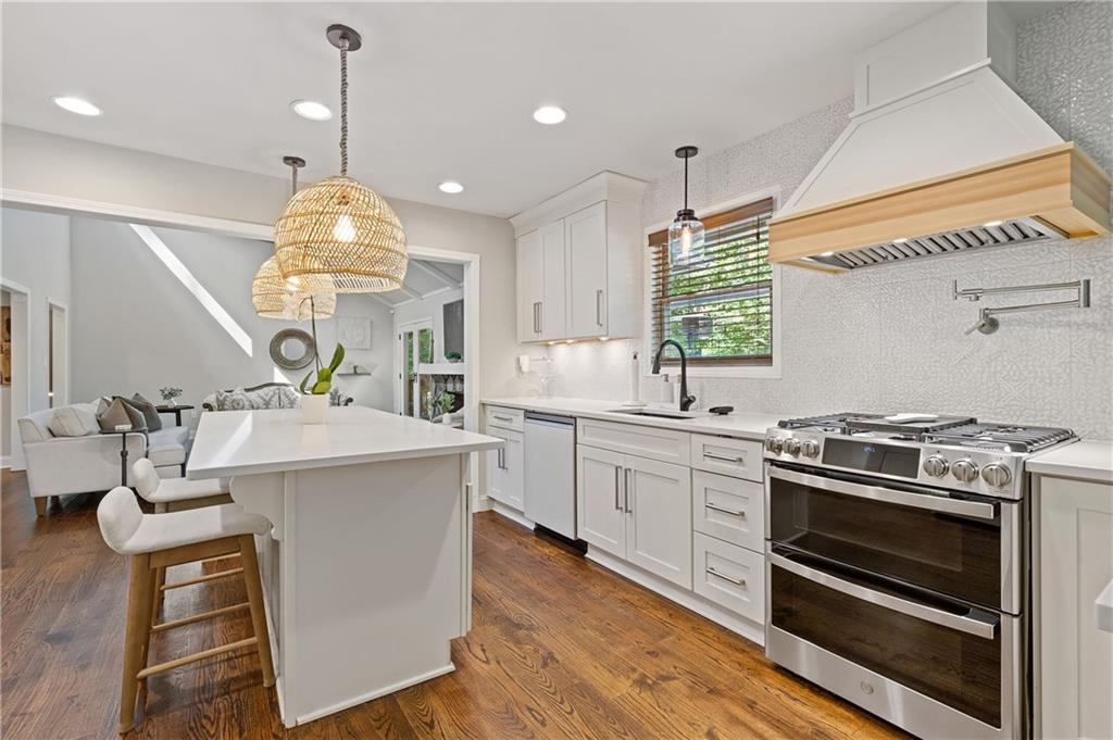 If you love entertaining and are looking for a home that stands out from the rest, this is it! This stunning residence in Indian Hills is far from your average cookie-cutter home. With a thoughtfully designed open-floor plan, the space flows seamlessly from room to room, making it perfect for hosting family and friends. Step into the gorgeous renovated kitchen featuring new quartz countertops, custom tile backsplash, custom vent hood, new stove, dishwasher and refrigerator and convenient potfiller along with views to the family room, dining room, and home office. You’ll find easy access to the walk-in laundry room and powder room. The large dining room comfortably seats 10+ guests, ideal for dinner parties and holiday gatherings. The family room features a vaulted beam ceiling, paired with ample natural light making this room feel both spacious and cozy, but the showstopper is the stunning fireplace - perfect for cozying up in the fall, winter and early spring seasons. Need a home office? A beautifully designed space with custom designed glass sliding doors, and a single panel glass door offers privacy while maintaining an open, connected feel. Tech lovers will appreciate the smart home upgrades, including Alexa hub integration that controls interior/exterior lighting, stove and vent hood, living room ceiling fan, ring cameras, motorized window shades in the owner’s suite, Ecobee smart HVAC system, and smart MYQ garage door. Garage upgrades added include built-in storage cabinets and beverage refrigerator, plus a large walk-in storage closet-perfect for pantry staples or seasonal items. Enjoy the outdoors in style with two designated patio areas for entertaining. Cafe lights and a misting system add to the ambience. Owner added a fully fenced backyard that includes a dog wash station, automatic doggie door with a smart sensor collar with customized indoor/outdoor access radius for your pets. The owner’s suite retreat easily fits a king size bed and more. The spa inspired ensuite bath has separate his and her vanities and a newly renovated walk-in shower, linen closet and custom walk-in closet system. Two guest rooms feature luxury plank vinyl flooring and a shared bath. One room is being utilized as a dressing room and extended closet space. Downstairs you’ll find an additional bedroom and full bath, separate game room with mini-bar, beverage fridge and additional storage closets. This home truly has it all-modern updates, smart technology, generous space and unique features throughout. Move-in ready and perfect for buyers who want both style and function.