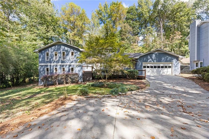 If you love entertaining and are looking for a home that stands out from the rest, this is it! This stunning residence in Indian Hills is far from your average cookie-cutter home. With a thoughtfully designed open-floor plan, the space flows seamlessly from room to room, making it perfect for hosting family and friends. Step into the gorgeous renovated kitchen featuring new quartz countertops, custom tile backsplash, custom vent hood, new stove, dishwasher and refrigerator and convenient potfiller along with views to the family room, dining room, and home office. You’ll find easy access to the walk-in laundry room and powder room. The spacious dining room comfortably seats 10+ guests, ideal for dinner parties and holiday gatherings. The family room showstopper is a stunning fireplace - perfect for cozying up in the fall, winter and early spring seasons. Need a home office? A beautifully designed space with custom designed glass sliding doors, and a  single panel glass door offers privacy while maintaining an open, connected feel. Tech lovers will appreciate the smart home upgrades, including Alexa hub integration that controls interior/exterior lighting, stove and vent hood, living room ceiling fan, ring cameras, motorized window shades in the owner’s suite, Ecobee smart HVAC system, and smart MYQ garage door. Garage upgrades added include built-in storage cabinets and beverage refrigerator, plus a large walk-in storage closet-perfect for pantry staples or seasonal items. Enjoy the outdoors in style with two designated patio areas for entertaining. Cafe lights and a misting system add to the ambience. Owner added a fully fenced backyard that includes a dog wash station, automatic doggie door with a smart sensor collar with customized indoor/outdoor access radius for your pets. The owner’s suite retreat easily fits a king size bed and more. The spa inspired ensuite bath has separate his and her vanities and a newly renovated walk-in shower, linen closet and custom walk-in closet system. Two guest rooms feature luxury plank vinyl flooring and a shared bath. One room is being utilized as a dressing room and extended closet space. Downstairs you’ll find an additional bedroom and full bath, separate game room with mini-bar, beverage fridge and additional storage closets. This home truly has it all-modern updates, smart technology, generous space and unique features throughout. Move-in ready and perfect for buyers who want both style and function.