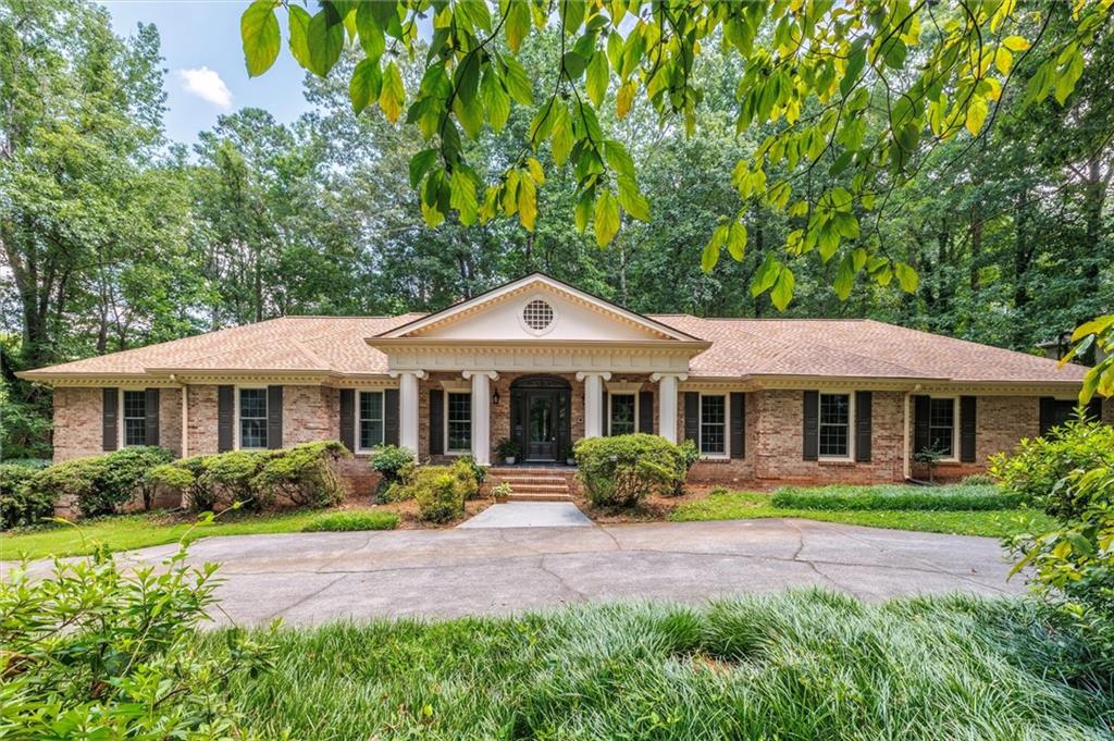 Hey! Come Look at Me Now! This freshly renovated Smoke Rise ranch boasts features that savvy buyers desire. From the moment you step onto the rocking chair front porch and enter the handsome foyer, you'll notice the quality construction and tasteful appointments. Imagine the possibilities: a baby grand piano, an office, or a living room in the spacious front room.
The dining room connects to a new kitchen that many cooks would dream of. Not only does it offer ample cabinetry, but it also opens to a casual dining area set in a large window overlooking the deck and backyard. The kitchen and casual dining area flow into the great room, which features deck access, a fireplace, and built-ins. A nearby half bath is convenient for guests.
The bedroom wing includes four bedrooms, each with an en-suite bathroom. The primary bedroom features double closets, a generous dressing area with a double vanity, a large glass-enclosed shower, and a separate water closet with a tub.
On the opposite end, you'll find a wonderful laundry room, mudroom, and garage access.
But wait – there's more! The lower level is essentially another whole house. It includes a full kitchen, plenty of living space, a bedroom suite with a sitting room, a bathroom with a jetted tub and separate shower, and walk-out access. This space could serve as an apartment, in-law suite, or cool teen hangout.
Located just a stone's throw from Stone Mountain Park and Stone Mountain, you can enjoy the privacy of your own retreat while being close to everything.
