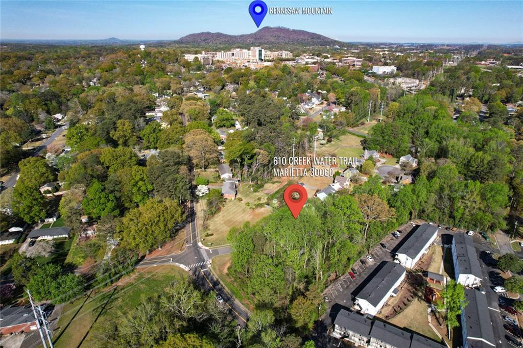 Endless possibilities await on this unique property! Situated among mature trees with a serene creek, this prime location is just minutes from the Historic Marietta Square, interstates, Kennesaw Mountain Battlefield, and The Walker School. Located in Marietta City's coveted West Side Elementary School district, the nearly one-acre lot is zoned residential (R3), offering the opportunity to build your dream home—or even a few! A copy of the plat map is available upon request. The property is not subject to any covenants and does not have to tie into the Cottages of Chicopee Subdivision.