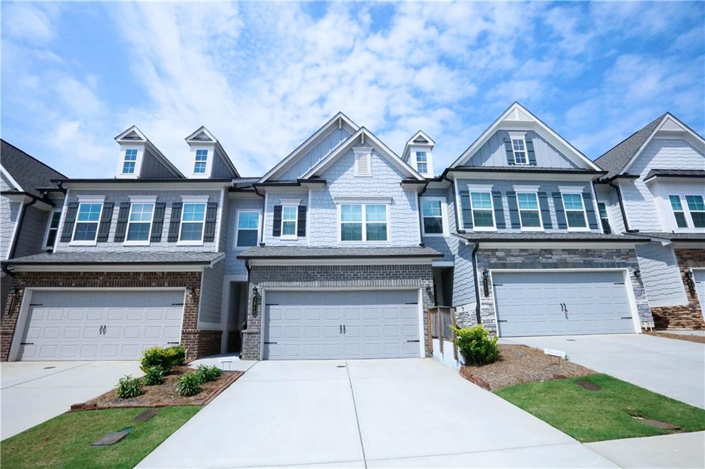 WOW!! Fabulous 3 bedroom/2.5 bath Townhome located in the Heart of Suwanee! Well-maintained and in excellent condition; built in 2022. Spacious 2-story floorplan with all Hardwood floors on Main level and in upstairs hall. Open concept floorplan with a large Great room and Dining area. Beautiful Kitchen includes an Oversized Island, White cabinets, Granite countertops, Tile backsplash, S/S appliances, and Pantry. Huge Master suite with Trey ceilings to include an ensuite with Double vanities, a separate Shower & Soaking tub, and a BIG walk-in closet. Two large secondary bedrooms upstairs. Very convenient location; within minutes to I-85. Close to shopping, resturants, and more!! Hurry!! Don't pass on this one!