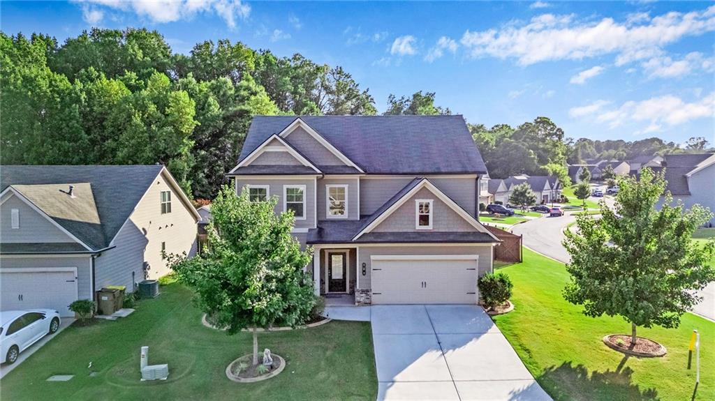 Discover your dream home at 969 Brighton Park Cir, nestled in the serene Jackson County enclave of Hoschton, GA! This charming 4-bedroom, 2.5-bath residence offers beautifully updated interiors and thoughtful design throughout. Step inside to an open-concept main level featuring a spacious living room filled with natural light, a modern kitchen boasting countertops, appliances, and a generous island perfect for entertaining. A cozy family room is ready for weekend movie nights or comfy reading with loved ones. Upstairs, you’ll find a luxurious primary suite with a walk-in closet and private en-suite bath, plus three additional bedrooms and a full bathroom—ideal for families or those needing a home office. A convenient laundry room completes the upstairs layout. Outside, enjoy the private, fenced backyard and covered patio—perfect for BBQs, gardening, or relaxing under the Georgia sun. Located within a friendly neighborhood offering easy access to schools, shopping, parks, and the highways, this home combines peaceful community living with everyday convenience. Don’t miss this incredible opportunity—schedule your showing today and make 969 Brighton Park Cir your new address!