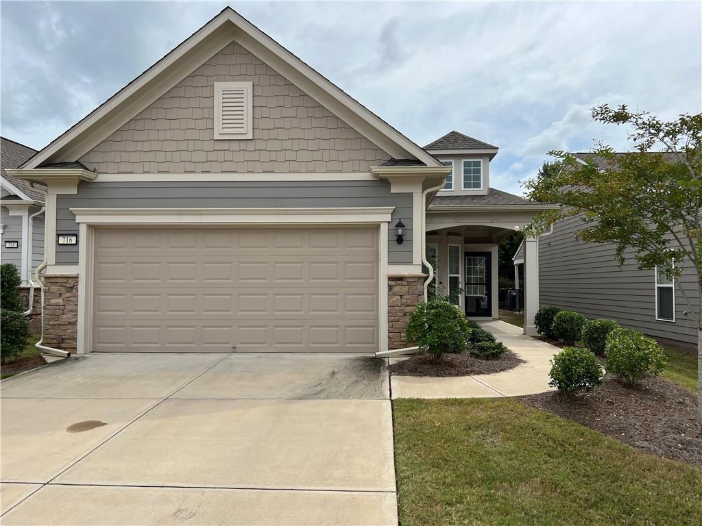 If you are looking for a remarkable neighborhood for the 55+ community, this is it. With all the amenities that you could desire right at your fingertips. This is truly resort style living without leaving your neighborhood; tennis, gold, pickle ball, swimming pools theater, physical fitness facilities and so much more. Welcome to this two bedroom, two bathroom, open concept living home. Hardwood floors invite you into the great room, dining room, kitchen and sunroom areas. Enjoy the flex room which could be an office/study or craft room. Relax in the great room by the fireplace while entertaining family and friends in the spacious dining area and kitchen with large island. Stainless steel appliances complete this gourmet style kitchen. Primary suite has en-suite bath with dual vanity, walk in shower with seating and large walk in closet. Secondary bedroom also includes bidet with tub/shower combination. Enjoy relaxing on your front or rear patios on those cool autumn evenings. If this is the lifestyle you are seeking........this is the place to be!!