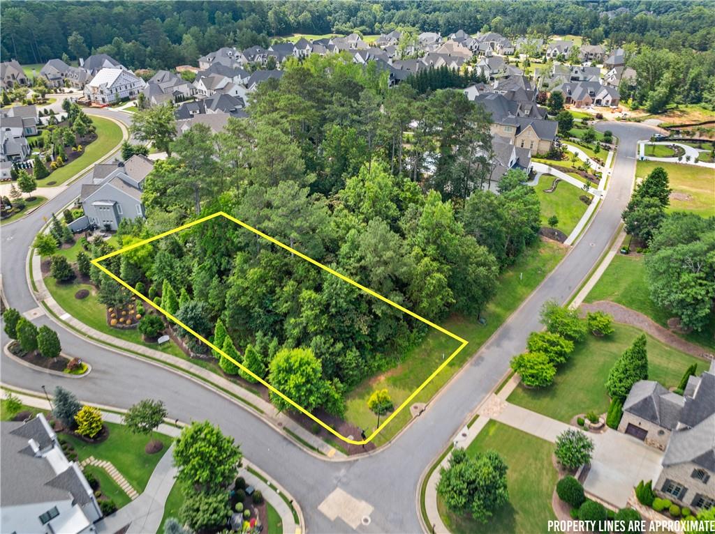 Situated within the prestigious gates of The Manor Golf and Country Club, this rare .65-acre corner lot offers the perfect canvas to build your custom luxury estate. Located in one of Milton’s most sought-after communities, this lot provides an expansive footprint, allowing for a grand residence, pool, and outdoor entertaining space.
A premier luxury builder is already in place, ready to bring your dream home to life with unparalleled craftsmanship and timeless design. Enjoy the privacy and prestige of this exclusive neighborhood, known for its world-class amenities including a Tom Watson-designed golf course, indoor and outdoor tennis facilities, aquatic center, fitness center, and clubhouse with fine dining.
This is a unique opportunity to secure your place in one of North Atlanta’s most elite communities.
Custom plans available upon request.