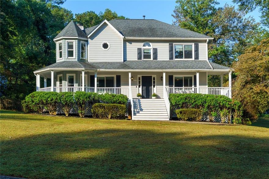 Sellers have found their next home and are offering this property at a fantastic value—don’t miss out!  Seller providing 2 Year Home Warranty.  Welcome to 4941 Willow Lane - 4BR/2BA + 2 half-bath traditional Colonial in the Willow Creek Community, Marietta side.  Minutes from Downtown Woodstock's prime shopping, dining and entertainment.  Set on a large corner lot, this home features a wrap-around rocking chair porch, hardwood and vinyl plank floors throughout, and a spacious family room with fireplace. The large kitchen offers granite counters, stainless appliances, breakfast bar, and pantry. Owner’s suite includes relaxing fireplace, trey ceiling, dual vanities, jetted tub, and walk-in closet. Finished basement with inside/outside entry provides great flex space for additional entertaining space, media room, playroom or guest suite. Outside, enjoy the deck, fire-pit area, and fenced yard. Updates include new front steps, new flooring in owner’s suite and lower level.  Active swim/tennis community w/2 pools.  Top Cobb County Schools.