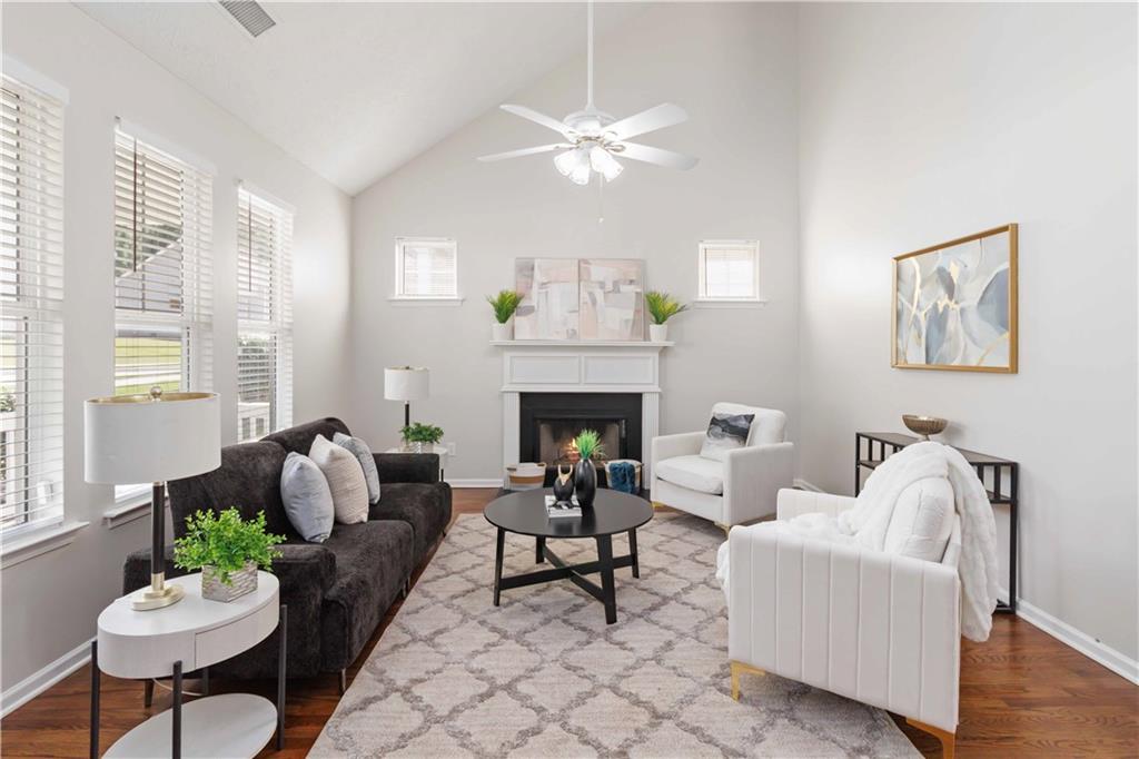 Beautifully Renovated 3-Bedroom, 2.5-Bath Home in a Prime Location! Welcome to this stunning and move-in ready home featuring 3 spacious bedrooms and 2.5 bathrooms. Step inside to a bright and airy 2-story great room with gleaming hardwood floors throughout and a cozy fireplace—perfect for gatherings. The updated kitchen showcases white cabinets, stylish tile backsplash, quartz countertops, a pantry, breakfast bar, and an eat-in dining area. Conveniently located off the kitchen is the laundry room and a half bath for guests. Additional main-level highlights include a closet, under-stair storage, and access to the fully finished, rear-entry garage. Enjoy outdoor living with covered front and back porches, ideal for relaxing or entertaining. Upstairs, the owner’s suite offers a spacious walk-in closet with custom shelving, double vanities, a soaking tub, and a separate shower. The second level also features two secondary bedrooms and a full bathroom with a tub/shower combo. Located in a vibrant community with fantastic amenities including a pool, playground, and clubhouse for events. Conveniently situated near shopping, dining, schools, and major highways. Just minutes from Camp Creek Marketplace and only 10 minutes from Hartsfield-Jackson Atlanta International Airport. Don’t miss the opportunity to own this beautifully updated home in a sought-after location. The location of this property is eligible for 100% financing. Payment assistance program available for 1st time homebuyers.