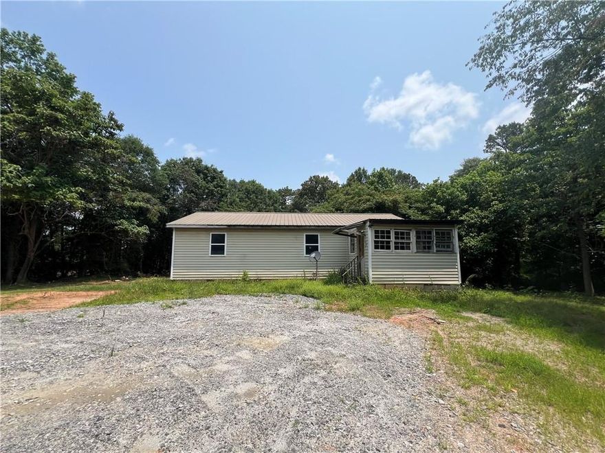 Unlock the potential of this 3 bedroom, 1 bath home nestled on a peaceful and private 1.2-acre lot in desirable Dawsonville, GA. Featuring a circular driveway and surrounded by nature, this property offers the perfect blend of seclusion and convenience—with no HOA restrictions to limit your vision!
Whether you're looking to renovate the existing home or start fresh and build your dream home from the ground up, this expansive lot provides the space and flexibility to bring your ideas to life.
Located just minutes from GA-400/US-19, the North Georgia Premium Outlets, and a variety of shopping and dining options, you’ll enjoy both tranquility and accessibility.
Sold as-is, this is a great opportunity for investors, builders, or anyone ready to create their own slice of paradise in North Georgia