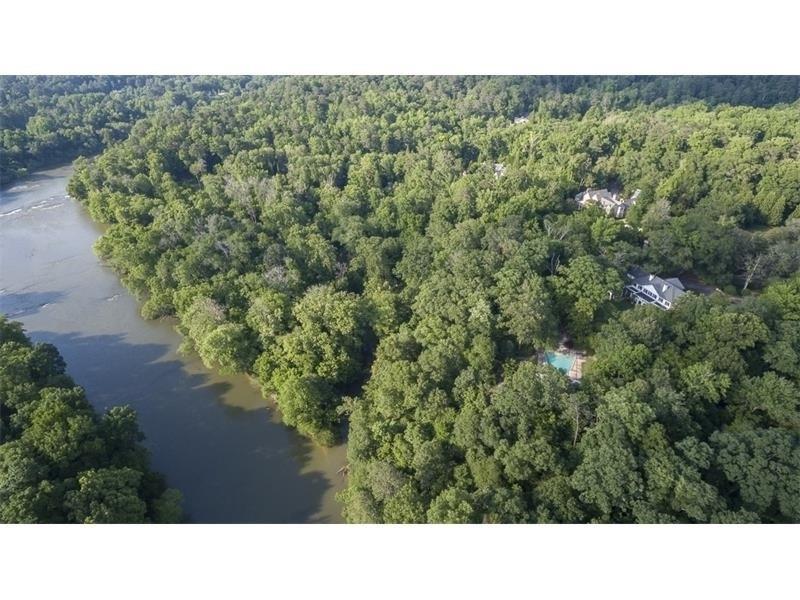 This classic Lewis Crook home is magnificently set at end of an alley of Magnolia Trees. Enjoy the large, flat backyard leading to a pool and poolhouse, overlooking the river. Built in 1931, the home is completely updated with modern details but still offers old-world charm with exposed beams, oversized windows and beautiful moldings.