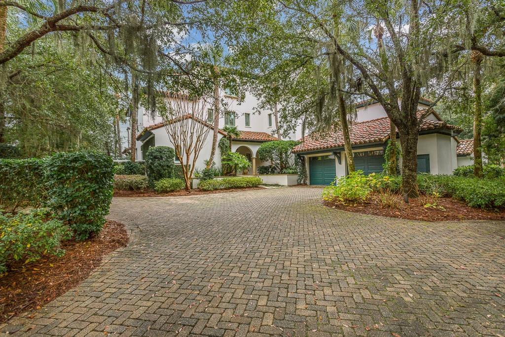 Gorgeous cottage nestled on the Hampton River offers a deep water dock, as well as beautiful views of little St. Simons Island, Atlantic Ocean and marshes of Glynn. Entrance foyer leads to living room with fireplace, light-filled kitchen with custom cabinets, granite countertop, island and opens to the den looking the river. Manicured grounds consist of outside fireplace, pool, hot tub, bar area and deep water dock- ideal for entertaining.