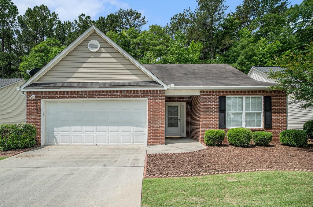 Welcome to Easy Living in the Sought-After 55+ Active Adult Community of Village Place! Tucked away in a Quiet Oasis within the vibrant and growing city of Loganville, this Charming Ranch Home offers Comfort, Convenience, and a True Sense of Community. Enjoy Hardwood Floors that lead into a Spacious Family Room featuring a Vaulted Ceiling, Cozy Fireplace, and Access to a Rear Screened-In Porch perfect for relaxing mornings or evening conversations. The Kitchen boasts Rich Wood Cabinets and a Breakfast Bar, flowing seamlessly into the Adjacent Dining Room with Wainscoting and a Large Picture Window. The Primary Bedroom is a peaceful retreat with a Tray Ceiling, Walk-In Closet, and Private Ensuite Bath complete with a Large Vanity. Two Additional Bedrooms share a well-appointed Hall Bath, ideal for guests or hobbies. Step outside to a Screened-In Porch and Patio with No Neighbors Behind offering added privacy and tranquility for entertaining, grilling, or relaxing. Enjoy Resort-Style Amenities including a Community Pool, Pickleball Courts, Clubhouse, Lawn Maintenance, and Regular Social Events all included with HOA fees. Located just minutes to Restaurants, Grocery Stores, and Shopping, this home blends serene surroundings with everyday convenience. Don't miss your chance to join this Welcoming and Active Community!