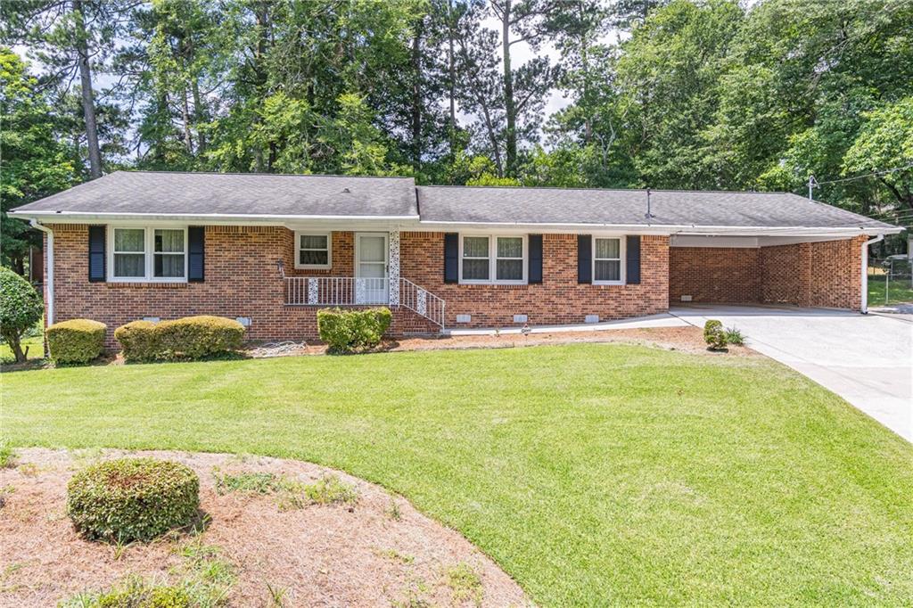 Stunning 4- sided brick ranch - move in ready, nestled in a sought-after community. This charming property combines classic appeal with modern convenience offering a comfortable lifestyle. Huge, secluded backyard. Newer tankless water heater. Newer furnace (2023). Updated energy efficient double pane windows (Rated Triple E). Newer roof. Martha Stewart slow closing kitchen cabinets with updated counter tops. And much, much more! Come take a look at this home that offers easy access to all major highways, downtown Atlanta, hospitals, Hartsfield- Jackson International Airport.