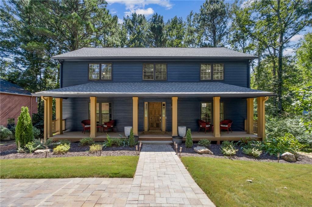 Welcome to this beautifully maintained four-bedroom, two-and-a-half-bath home in East Cobb, where thoughtful updates meet timeless comfort. Move-in ready and filled with flexible living spaces, it offers the perfect backdrop for everyday living and effortless entertaining. Inside, the traditional front living room has been enhanced with wall-to-wall custom built-ins, creating an ideal home office or library. The eat-in kitchen provides exceptional storage with abundant cabinetry and a spacious pantry, and it flows seamlessly into a light-filled sunroom. Just beyond, the family room features a striking stone fireplace and direct access to the screened-in porch—perfect for year-round enjoyment with views of the expansive backyard and oversized lot. Upstairs, the oversized primary suite includes a walk-in closet and dual vanity. Three additional generous bedrooms and a convenient laundry closet complete the second level. The home also offers abundant storage in the basement along with a two-car garage. Multiple outdoor living spaces make this property truly special, including a charming rocking-chair front porch, the sunroom off the kitchen, a screened-in porch, and a back patio ideal for entertaining. Recent updates include a new roof, HVAC system, water heater, siding, fresh interior and exterior paint, a fully renovated powder room, and new carpet upstairs—providing peace of mind and true move-in readiness. Nestled in the established Piedmont Forest community, this home offers the best of East Cobb living with top-rated schools, parks, everyday conveniences nearby, and easy access to I-75 and I-575.