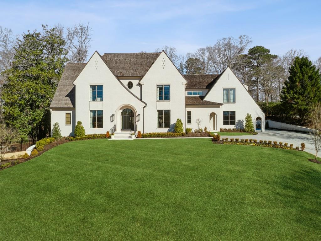 Tucked away on a quiet cul-de-sac, this one-of-a-kind newer construction home offers the perfect blend of luxury, functionality, and timeless design. Intricate architectural details found throughout the home include detailed millwork, iron windows & doors, wide plank hardwoods and custom lighting. An open, airy layout creates the perfect backdrop to accommodate everything from the flow of everyday life to entertaining on a large scale. The centerpiece of the home is the expertly crafted kitchen complete with a spacious center island, dramatic vent hood, a suite of premium appliances, walk-in wine cellar, charming breakfast nook and large scullery. The kitchen overlooks the fireside living room with stunning iron doors leading to a large, covered patio designed for year-round enjoyment complete with an outdoor fireplace, built-in grill, and TV area. The flat, fenced backyard features a sparkling pool/spa and cozy firepit area. The main-level primary suite is a true retreat, boasting a spa-like bath with dual vanities, a soaking tub, a separate shower, and two generous walk-in closets. Upstairs you'll find a versatile flex/office space along with four spacious bedrooms each feature their own en-suite bath. A fully finished basement completes this extraordinary home, complete with a large living area, golf simulator, home gym and sauna. Don't miss this rare opportunity to own a truly exceptional home in one of Buckhead's most coveted locations.