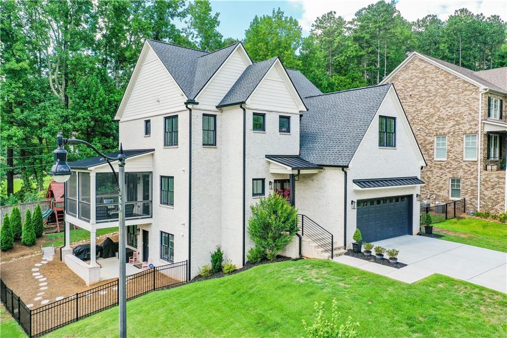 Welcome to your dream home, where modern design meets thoughtful craftsmanship and effortless elegance, nestled within a tranquil 9-home subdivision in the highly sought-after East Cobb location. This stunning 4-bedroom, 4.5-bath residence welcomes you through a covered foyer entrance into an expansive interior boasting 10-foot ceilings on the main level, enhancing the sense of grandeur throughout. At the heart of the home, the spacious white kitchen dazzles with sleek contemporary cabinetry, a custom vent hood, and sophisticated backlighting accents. A grand quartz island, with seating for four, is complemented by high-end stainless-steel appliances, including a wall oven, pot filler, and a 5-burner stove top. Flowing seamlessly from the kitchen, the family room exudes warmth and style, featuring a horizontal digital fireplace and access to a serene, screened porch with tranquil, tree-lined views.
The main level offers versatility with a room perfect as an office, playroom, or library. A formal
dining area nearby sets the stage for hosting memorable gatherings, while a walk-in pantry and mudroom add practical convenience to the home’s stylish design. Upstairs, a wide hallway leads to two generously sized secondary bedrooms, each complete with an en-suite bath and walk-in closet, along with the luxurious primary suite. The primary suite is a true retreat, featuring a spa like bath with a freestanding tub and an expansive frameless glass walk-in shower. A bonus room on this level adds flexibility, ideal as an office or playroom.
The finished terrace level is an entertainer's delight or a retreat for guests or teens, offering a private bedroom with a full bath and a vast secondary living area, perfect for a theater room or game space. Step outside to discover a beautifully landscaped backyard, complete with a spacious fenced yard for privacy and versatility. The yard also features a stylish covered patio, providing a perfect space for outdoor dining, relaxation, or year-round enjoyment while embracing the beauty of your surroundings. This outdoor haven perfectly complements the home’s charm, creating an idyllic retreat for your lifestyle.
Neighborhood has no Swim/tennis, but owners joined nearby East Cobb Swim & Tennis for $550.00/yr-great optional amenity!