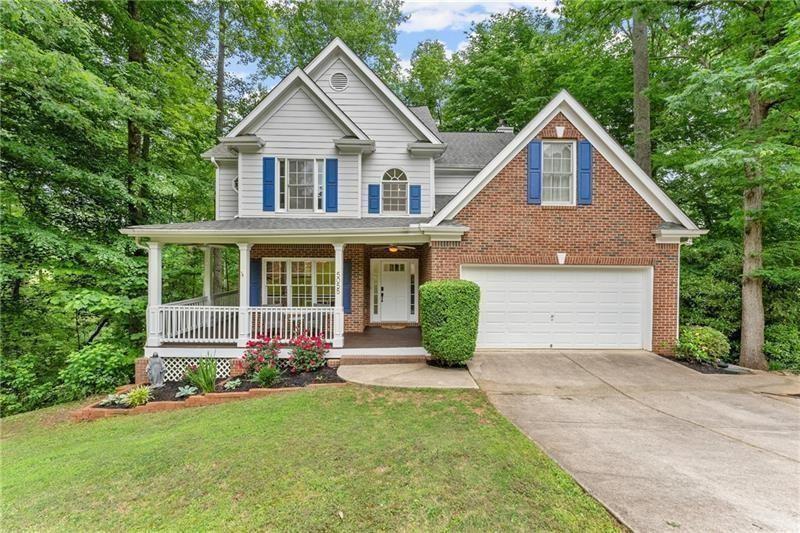 Nestled in Alpharetta's sought-after West Forsyth district, this home in Hamptons Grant offers the perfect blend of elegance and comfort. As you step onto the front porch, you're greeted by the inviting charm of this home. Through the entrance, two-story foyer leads to the dining room area and staircase open to below. The main level features an updated kitchen with white cabinets, a large island, and a seamless flow into the breakfast nook and living room, ideal for entertaining or relaxed gatherings. The living room features a cozy fireplace and a stunning triple window framing picturesque views of the private, wooded backyard. Escape to outdoor bliss on the two-story back decks, offering ample space for entertaining guests or enjoying tranquil moments amidst the serene surroundings. With the potential to be screened in, these decks promise year-round enjoyment of the beautiful outdoors. Upstairs, there are three secondary bedrooms and a full bathroom, providing comfortable accommodations. The primary bedroom exudes luxury with a tray ceiling, triple windows framing scenic views, and an ensuite bathroom featuring a separate tub and shower, double vanity, and two walk-in closets. A large unfinished basement presents endless possibilities for customization, with access to the lower level deck adding to the versatility of this space. Throughout the home, abundant natural light floods the living spaces, enhancing the ambiance of warmth and openness. Beyond the lush greenery lies a private sanctuary, where flowing creeks and views of pastoral landscapes create an atmosphere of tranquility. Despite its central location, this backyard oasis offers a sense of seclusion and natural beauty