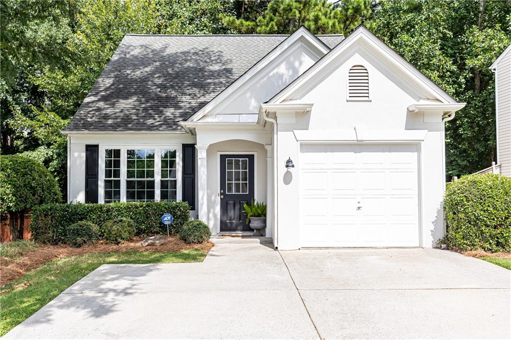 Prime Alpharetta Rental! This beautifully updated 3-bedroom, 2.5-bath home is tucked within a desirable swim community just minutes from top-rated schools, Avalon, Downtown Alpharetta, and The Greenway. The bright, open layout showcases a soaring two-story living room with a cozy gas fireplace, a dining area, and an updated kitchen with new stainless steel appliances. Stylish LVP flooring flows throughout the entire home, including the main-level primary suite with walk-in closet and easy access to the living space. Upstairs offers two additional bedrooms, a full bath, and a laundry room with extra storage. Thoughtful upgrades include a brand-new HVAC system, washer and dryer, toilets, recessed lights, ceiling fans, blinds and fresh paint throughout. A fenced, wooded backyard with a flat patio completes the home—perfect for outdoor living, relaxing, or entertaining.