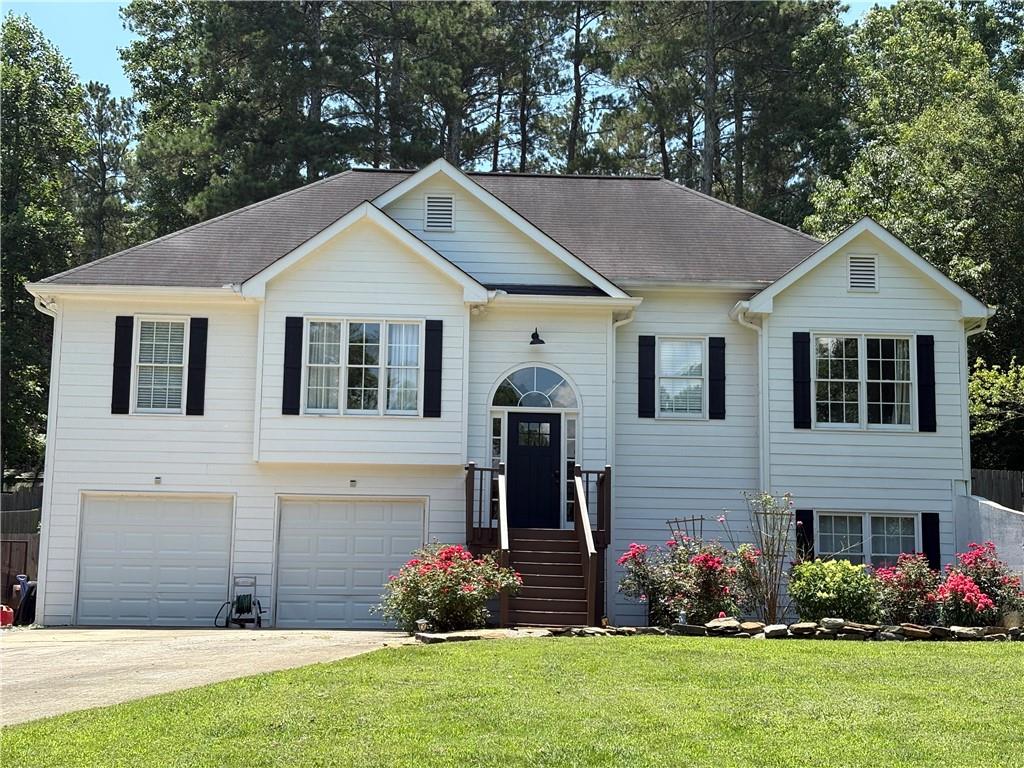 Welcome home! Discover charm and comfort nestled in at Blacks Mill Place. The home sits on a well-maintained lot with a fully fenced backyard, providing ample space for outdoor activities, and relaxation. The open-concept living and dining area features large windows that let in an abundance of natural light. The living room is cozy yet spacious, with hardwood floors and a fireplace as the focal point. The home offers 3 or 4 full bedrooms and 2 full baths upstairs. The downstairs has a finished basement with two versatile rooms plus ample storage, perfect for an office, playroom, media room, or it could be used as a 4th bedroom with a private half bath. The two car garage has storage under the stairs as well as a work bench tucked away in its own area. The fully fenced backyard is a private oasis, perfect for enjoying the outdoors. Whether you’re entertaining guests, hosting a barbecue, or simply unwinding after a long day, the backyard offers a great space to make memories. The fenced area also has a dog run up top to keep your animals kept while you're entertaining.
Easy access to GA-400 for commuting, plus shopping, restaurants, medical, and local attractions just minutes away! Come and make this house your home!
New paint to the exterior as well as inside!
