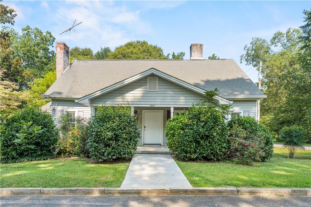 Come make this renovated 1920's bungalow in Downtown Palmetto yours today! Walking distance to downtown, Piggly Wiggly Grocery Store, laundromat and more! This home sits on a beautiful corner lot with wooded views from your back yard. Sit on the front porch and enjoy morning coffee before walking to downtown Palmetto to run errands. Cozy entryway foyer with carpet flooring throughout. Fireplaces in the home are non-working but make a great setting for anyone wanting the classic charm that this home has. Spacious enclosed rear porch overlooks the backyard. While also being walking distance to Palmetto, this home is a short drive to Serenbe, I-85 and surrounding cities. Tenant pays all utilities. Pets allowed with pet fee.