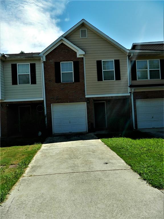 This is a single-family townhouse in a great location with easy access to shopping, Restaurants, and I-75. It has three bedrooms and two and a half bathrooms. There is a front porch and a patio at the back, plus a one-car garage.