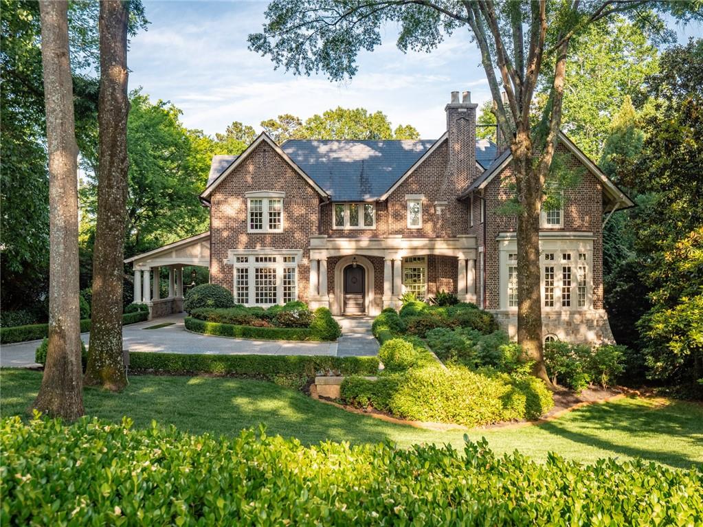 Beautifully designed custom home by Architect Frank Neely and built by Mike Hammersmith. Gorgeous front door leads to a grand entrance foyer that connects oversized living spaces, ideal for entertaining. Formal dining room, handsome wood paneled study and living room with French doors leading to the covered patio. Chef’s kitchen offers Calacatta Gold marble island, honed black granite counters and opens to the breakfast room. Kitchen also offers two Subzero refrigerators, Bosch dishwasher and Wolf range with double ovens. Sought-after primary bedroom on main with walk-in closet and surround sound. Primary bath includes dual vanities, heated floors, separate tub and steam shower. Another feature in the primary bathroom consists of a stackable washer/dryer and the cabinets in the bath are open on each side, perfect for easy access to towels and laundry storage! Thoughtfully detailed upper level staircase includes 4 bedrooms all with private baths. All the vanities in the bathrooms are custom. Upper level also offers laundry room, 2 bonus rooms, ideal for an exercise room or playroom and private deck with artificial turf for star gazing. Finished terrace level has golf simulator room, could also be used as a media/theatre room and has options to play other sports including tennis and soccer, built-in bar, recreation room, surround sound, guest bedroom and full bath. This home holds a superior level of craftsmanship that features French Oak floors, fumed oak walls on the main level and upper level staircase, generator & geothermal energy. The manicured grounds consist of mature landscaping, covered porch with fireplace overlooking the pool and spa, which are saltwater and heated. Porte-cochere, security gate, 3 car detached garage with space for an in-law suite or au-pair suite and covered grilling area. This home is truly a must see!