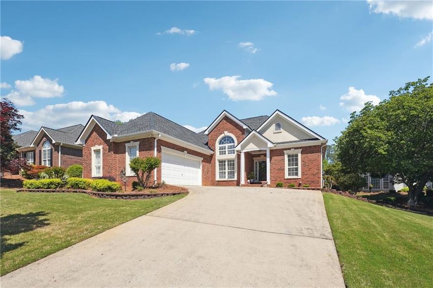 Welcome to the ultimate in easy, low-maintenance living! This beautifully updated one-level home is tucked inside a quiet, gated community where comfort meets convenience—and the HOA takes care of almost everything for you.

Step inside and be greeted by soaring ceilings, an open-concept layout, and plenty of natural light. The bright, airy living space flows seamlessly into the dining area and a sleek, modern kitchen featuring quartz countertops, a new designer backsplash, and plenty of room to gather with friends or enjoy a quiet evening in.

Need a cozy spot to relax? You’ll love the added sunroom—perfect for morning coffee, reading, or just soaking in the light. Step outside to your covered back deck, ideal for grilling and entertaining year-round.

With three generously sized bedrooms, including a private primary suite and two flexible guest rooms (or the perfect home office), this home offers both space and versatility—all on one easy-to-navigate level.

You’ll also enjoy a two-car garage, a low-maintenance yard, and community perks like gated security, lawn care, trash service, and sidewalks—all included in the HOA.

Whether you’re looking to downsize, simplify, or just enjoy life with less upkeep, this rare gem offers the lifestyle you’ve been looking for. Come see why this home is the perfect fit!
