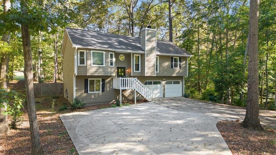 This beautifully maintained 3 bed, 2 bath home features brand new flooring in all bedrooms, fresh interior paint, and a completely renovated lower level bathroom. The bonus room downstairs offers incredible flexibility, ideal for a 4th bedroom, office, gym, or media space. Major updates bring peace of mind for years to come, including a new AC unit, $28,000 worth of new windows and doors with a lifetime guarantee, and a newly added parking pad for up to four additional vehicles. Step outside to enjoy the fully fenced backyard, perfect for kids, pets, or quiet evenings outdoors. With no HOA and protected land to the right of the property, you’ll love the added privacy and freedom this home offers. Located in a quiet, established neighborhood just minutes from shopping, dining, and top Gwinnett County schools. This one checks all the boxes for location, upgrades, and livability.