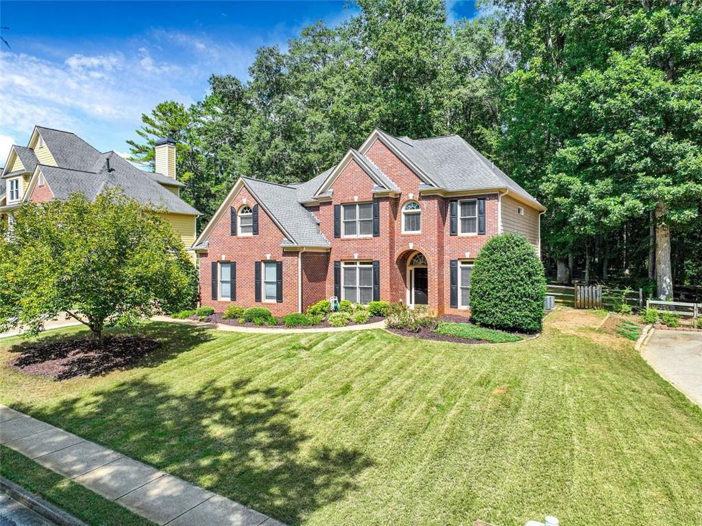 4 bedroom, 3 full baths, .48 acre level lot in sought after swim/tennis/golf community of Bradshaw Farm. New interior and exterior paint. Huge owner's suite with oversized closet. Large kitchen with stainless appliances, double oven, granite counterops. Main level boasts updated full bathroom, separate office and dining room, large laundry room and bedroom. Excellent condition engineered hardwood floors! Media/playroom on second floor as well as oversized primary suite, 2 additional bedrooms and updated bathroom. tankless water heater. Move in ready! Excellent schools! Shopping and hospital nearby. You won't be disappointed.