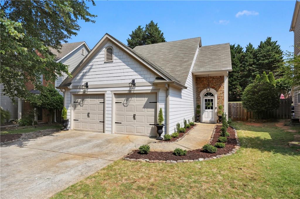 Welcome to your fully renovated home in the quiet and friendly Crabapple Walk community! This charming and modern remodeled home is nestled in the highly sought after Crabapple area, located directly between downtown Alpharetta and downtown Roswell. With 3 beds, 2 ½ baths, this house boasts a stunning, open concept living space with the master on the main. Open Kitchen offers a large island with recessed panel cabinets, energy efficient stainless-steel appliances, and quartz countertop. The primary suite on the main floor offers a completely renovated bath with marble floors, updated walking closet. Everything in this beautiful house is 3 years young, Hardy plank siding, new side door & all windows, energy efficient tankless hot water, new HVAC & ducting, new white oak flooring throughout, all new light fixtures, and new side fencing and professional landscaping and too many details to list. This house is a must see and is what you see on HGTV!