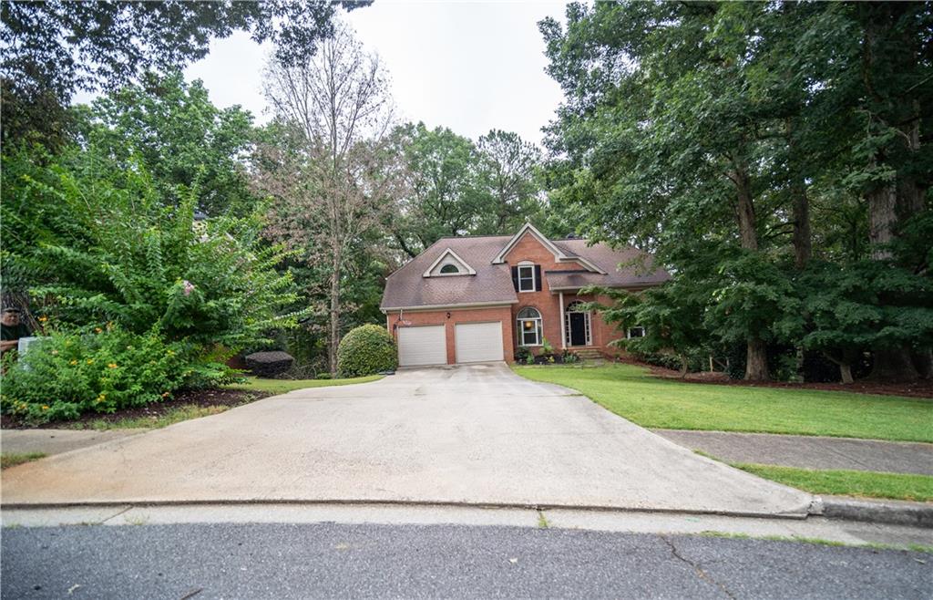 Great Location and Schools! Welcome to highly sought Olde Atlanta Club, within the top-rated Lambert High School District! Well maintained 5 Bedroom 3.5 bath home with finished basement features a grand two-story foyer, separate formal living and dining rooms, and an open-concept floor plan. Residents enjoy the Luxury Vinyl(LVP) flooring throughout the main level and basement, fireplace in cozy large family room and separate dining room. The home has a formal living room that can also be used for a home office or playroom with an adjoining formal dining room perfect for all your parties and holiday dinners. Your buyer will love the large open remodeled kitchen, which is well-appointed with tall, white cabinets, beautiful quartz counter tops with lots of counter space, and stainless-steel appliances. Also, storage cabinets and eating area in the kitchen. The Master bedroom with sitting area boast free standing tub, stand on shower and walk in closets. The panoramic view of nature can be enjoyed from deck at kitchen and basement level. The house sits on a level front yard which makes it ideal for little ones and fur babies to enjoy the outdoors. Located in one of Suwanee’s most desirable golf and swim/tennis communities, residents enjoy resort-style amenities: golf course, clubhouse, two pools, tennis and pickleball courts, playground, pavilion, and more. Adjacent to Chattahoochee Pointe Park for walking trails, kayaking, and fishing, and just minutes to shopping, dining, and entertainment. Refrigerator included in the sale. All of this in the top-rated Lambert High School district, with Riverwatch Middle and Johns Creek Elementary just minutes away. Ready to Move in. Much more...Must see