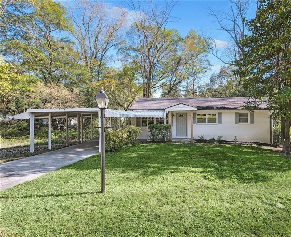 This beautiful fully renovated home features brand-new electrical, plumbing, windows, and stunning hardwood floors throughout, offering both charm and peace of mind. The expansive open-concept kitchen is perfect for entertaining, complete with a large island, coffee bar, granite countertops, stainless steel appliances, and recessed lighting. Step outside and enjoy the newly added large, fully fenced-in backyard—ideal for pets, play, gardening, or outdoor gatherings. Nestled on a quiet street filled with natural light, this home is just minutes from Westside Park, public transit, and downtown Atlanta. The spacious basement is ready for your vision giving opportunity to add another bathroom and two bedrooms.