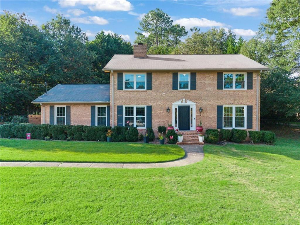 Welcome to 200 Clifton Drive in Homewood Hills subdivision in Athens! This charming home offers a perfect blend of character and modern updates. Step inside to find gleaming hardwood floors, a beautifully updated kitchen, and recently renovated bathrooms designed for today’s lifestyle. Natural light pours through the NEW WINDOWS, creating a warm and inviting atmosphere throughout. Outdoors, you’ll love the thoughtfully designed landscaping with raised garden beds, vibrant flower gardens, and plenty of space to enjoy the seasons. Whether you’re entertaining friends or simply relaxing at home, this property offers comfort, charm, and convenience in a desirable Athens location.