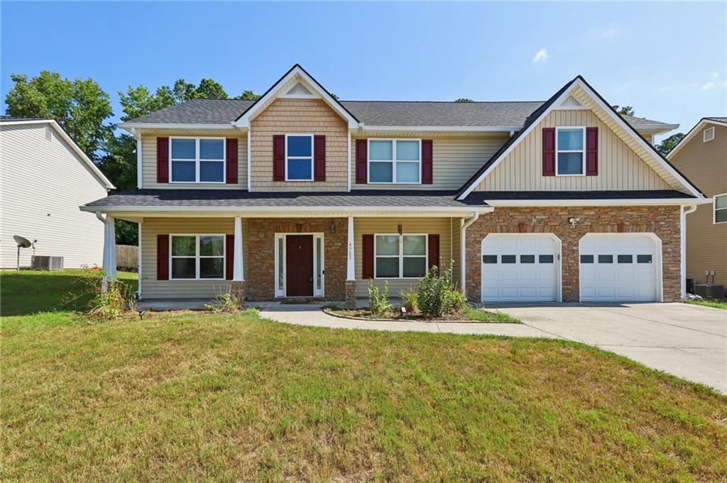Welcome home to this fantastic 5 bedroom, 3 bath, two story home. Home features an inviting front porch that leads into a hardwood foyer and main level with separate formal dining room, spacious updated kitchen with antique white solid wood cabinets, granite counters, SS appliances, island, breakfast area and pantry. Beautiful and easy to maintain LVP floors throughout main level. Main level also offers a large family room with stone fireplace and access to the attached 2 car garage. Main level also offers the Primary suite w/ sitting area and an ensuite with separate tub and shower and double cherry vanities. Upper level boasts 4 more secondary bedrooms and 2 more full baths. Updates include new roof 2022, new water heater 2022, fresh paint. Conveniently located close to shopping, dining, and I-20. Don’t wait…Call today to schedule your tour!!