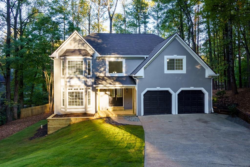 This recently updated beauty in East Cobb has everything you could want and more! Nestled on a .34-acre lot on a quiet cul-de-sac in the Windsor Oaks community that features amenities that includes a standard short-course competition pool, 4 lighted tennis courts, 1 multi-use court, 2 event pavilions and a playground. The neighborhood sponsors a swim team and has several very active tennis teams. This home is also in the highly sought after school Lassiter School district.
From the outside, you have a brand-new roof, new gutters and freshly painted exterior, new front porch with room for rocking chairs if you desire. Upon entering the new French double front doors, you have just under 5000 square feet of beautifully renovated living space on 3 spacious floors to enjoy! In the kitchen you’ll find All Wood Soft Close Cabinets with Quartz countertops, large workstation sink (comes with cutting board, drying rack and colander) a large island with seating for 3+, a 6-burner professional quality gas range/oven, pot filler, 3 shelf dishwasher, built in microwave and Samsung Flex French Door Smart Refrigerator with AI Family Hub +. Just off the kitchen you have a large breakfast nook with new windows overlooking the new large deck. In the family room you have a gas fireplace wrapped in Quartz. Just off the family room you have an updated 1/2 bath with marble countertops and all wood vanity. The laundry room has custom cabinetry. All appliances are included with the home! The 2-car garage has epoxy floors, and new insulated steel garage doors. Upstairs you have 4 large rooms with spacious closets, a full bathroom with bathtub and a dual sink vanity with marble countertops. In addition to these 4 rooms, you have the large owner's suite with on suite bathroom with dual vanities, a separate makeup vanity area, freestanding tub, huge shower with a bench and misters and a custom California closet. Journey down to the completely finished basement and you’ll find the same LVP flooring that is throughout the 2 other floors, a large bedroom, a huge closet, a full bathroom with low step in shower, a bar area with a dual zone wine fridge, full size workstation sink, full size refrigerator, all wood soft close cabinets with quartz countertops. In the main living area, you have a large open room with a built-in electric fireplace. There are 3 additional rooms fully finished that could be a game room, storage, or even your own custom wine cellar! The basement could easily be an in-law suite or potential income producing space with its own entrance. All 3 AC units have also been recently replaced as well as a new 199K BTU Tankless Hot Water Heater that provides up to 11 gallons of hot water a minute!
This house has it all and more and is waiting for you to make it your home! This home is close to lots of great shopping, restaurants and close proximity to major highways.