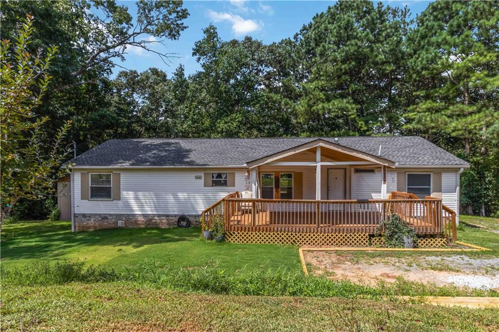 Located just minutes from Lake Allatoona, I-75, and the LakePoint Sports Complex—this well-maintained 3-bedroom, 2-bathroom home sits on a peaceful and private 0.75-acre lot. Whether you're looking for an affordable primary residence or a strong investment opportunity, this property checks all the boxes. The home is set on a permanent foundation, making it eligible for traditional financing. Recent upgrades include brand-new windows, a roof replaced in 2023, a new covered front deck, and an additional rear deck—perfect for outdoor entertaining. A newly built storage shed adds extra convenience and functionality. Plus, the furnace was replaced in 2024 for added peace of mind. No HOA. Enjoy being within walking distance to Lake Allatoona and surrounded by nature, while still being close to major highways, shopping, and dining.