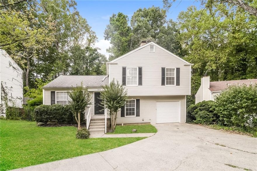 Welcome to Highland Trace subdivision, located in the Kell High School district. This split-level home features 3 bedrooms and 2 full bathrooms, all situated on the upper level, providing privacy and separation from the main living areas. Upon entering, you're greeted by a welcoming foyer that leads into the spacious fireside family room. Adjacent to the family room, the dining area flows seamlessly into a well-appointed kitchen, featuring stainless steel appliances, white cabinetry, and tile flooring. The main floor also includes a convenient laundry room. Outside is an oversized deck that overlooks the private backyard. The attached garage provides secure parking and additional storage.