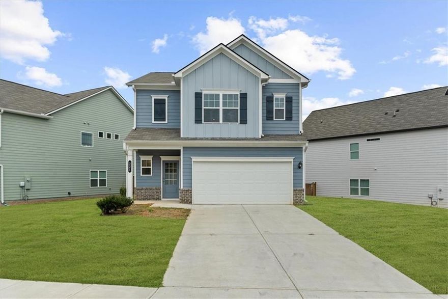 Welcome to this beautifully maintained 3-bedroom, 2.5-bath Craftsman-style home in the desirable Sawgrass community. Built in 2023, this home offers modern design, spacious living, and easy access to I-575, Canton & Ball Ground’s shops and restaurants, and top-rated schools. Step inside to a bright, open layout featuring a large kitchen with ample storage, a spacious island, stainless steel appliances, and updated lighting. The kitchen flows seamlessly into the inviting living room—perfect for everyday living and entertaining. A cozy breakfast nook provides the ideal spot to enjoy your morning coffee. Upstairs, you’ll find three generously sized bedrooms and a convenient laundry room. The primary suite impresses with tray ceilings, a large walk-in closet, and a bath complete with a soaking tub, separate shower, and a double vanity. Enjoy the outdoors in the flat, level backyard with a patio—perfect for relaxing or hosting gatherings. Additional features include a two-car garage and fantastic curb appeal. Move-in ready and like new, this home perfectly blends comfort, style, and location.