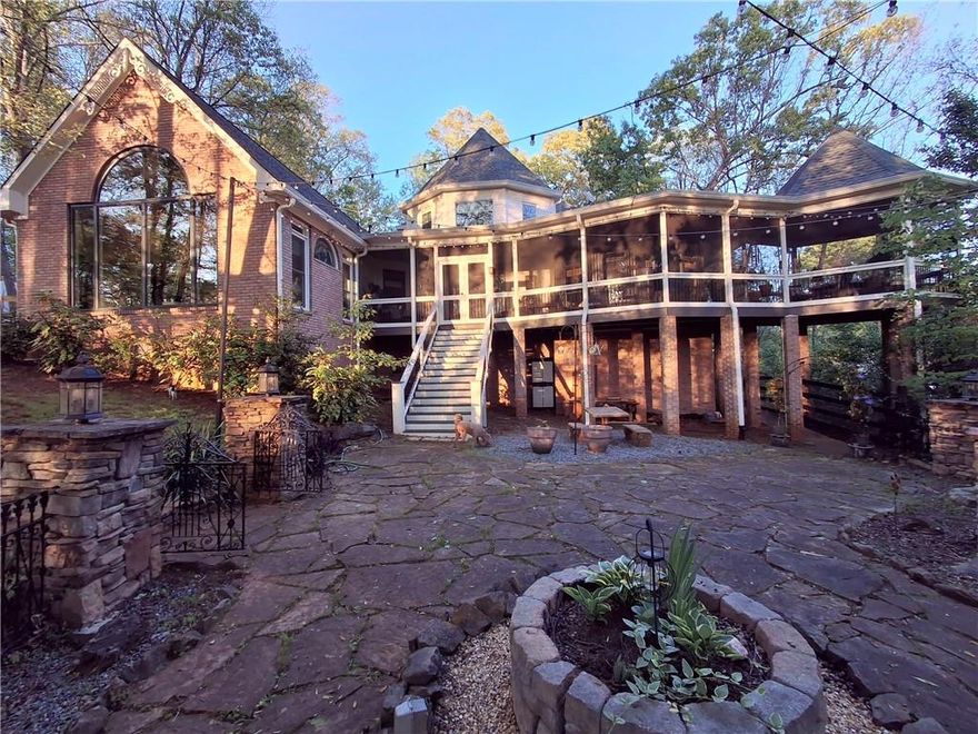 Stunning Victorian Oasis with Tropical Charm:
Welcome to your dream home—a hidden gem nestled amid lush, mature trees and exquisite landscaping. This enchanting multi-level Victorian-style home remains a private sanctuary, tucked away from the road and embraced by nature's bounty.

Exterior Bliss:
The professionally landscaped grounds boast an array of tropical foliage, including banana trees and giant elephant ears, creating a serene and exotic ambiance. The property features a charming stone courtyard with elegant iron gates and fencing, leading to a tranquil koi pond and a picturesque covered gazebo. Professional lighting strategically placed around the house and garages enhances the property's enchanting allure.

Interior Elegance:
Step inside to discover a blend of classic Victorian charm and modern luxury. The gourmet kitchen is a chef's delight, with commercial-grade Stainless Steel Kitchen Aid appliances, a spacious island, and a delightful breakfast area. Beautiful cherry cabinetry adorned with dragon stone granite and unique copper sinks add to the kitchen's sophisticated appeal.
The main level offers a formal living room and dining room, a luxurious Owner’s Suite, and a convenient laundry area. The family room features a striking stone fireplace, a custom wood-carved bar with a sink, and stunning 14-foot ceilings with exposed beams. Floor-to-ceiling windows provide a breathtaking 180-degree view of the front yard and koi pond.

3 Bedrooms: Spacious and full of natural light, each bedroom offers comfort and style. Upstairs features 2 bedrooms, a full bath, and a loft space currently used as an office that overlooks your lush forest backyard and courtyard.

Detached 4-Car Garage: Plenty of space for vehicles and storage, with an unfinished upstairs ready for your personal touch.

Relaxation and Entertainment:
Enjoy the outdoors with two screened porches perfect for year-round relaxation. Perfect for enjoying the outdoors without the hassle of pests. Great spaces for entertaining or unwinding with a book. 

Additional Features:
The property includes a large partially finished basement with an additional garage space, workbench, storm room, and built-in wood shelving for ample storage. A two-story, four-car detached garage offers 850 square feet of unfinished living space on the second floor, ideal for a guest house or teen retreat, ready for your personal touch. The garage is equipped with electric and water connections, and all doors feature automatic openers. 

Seize the opportunity to make this secluded, tropical paradise your own. Whether you're captivated by the tranquil outdoor spaces, the elegant interiors, or the potential for expansion, this property offers endless possibilities.