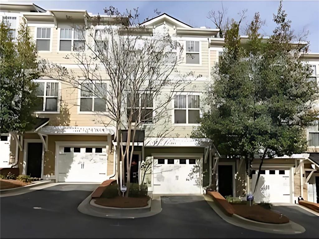 LOCATION LOCATION LOCATION! Fantastic opportunity to live in BROOKHAVEN.EASY ACCESS TO BUCKHEAD, CHOA, EMORY, MARTA, GA 400, and I-85 and WALKING DISTANCE TO PEACHTREE CREEK GREENWAY! Well-maintained home. Hardwoods throughout. 1 car garage. This townhome has such an awesome layout, complete with first floor bedroom with full bath, perfect for roommate plan, guest or office. Large living area with gas fireplace, gourmet kitchen with granite counters and stainless-steel appliances. Oversized dining room which graces the front of the home, with so much natural light. Upstairs, spacious master suite, double closets, master soaking tub, double vanity and separate shower. Head down the hall to another bedroom with its own private bath. ALL BEDROOMS HAVE THEIR OWN BATHROOMS. Walk out to your deck and enjoy your beautiful private entertainment deck pace. This home is perfect "work at home" house as it has three separate areas for privacy. Gated community.