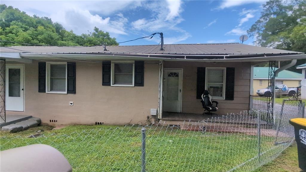 Come check out this wonderful home that boasts it's own huge workshop outback to add even more space for you to move around in! This 3-bedroom, 1.5-bath home has an open concept living/dining room space and a great eat-in kitchen with newly installed LVP flooring. Hardwoods throughout the bedrooms, LVP in the kitchen, and tile in the living room keep the home nice and easy to clean. The property includes a spacious workshop, a large storage shed, and a 2 car aluminum carport. Prime location just minutes from the vibrant heart of downtown Rome, schools, parks, and local amenities.