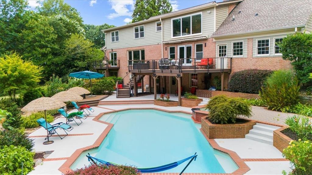 Nestled on a private, one-acre lot just moments from Highway 400 and the serene Chattahoochee River, this fully remodeled luxury estate offers a rare blend of elegance, privacy, and convenience. Located in the exclusive Huntcliff community—home to the Cherokee Golf Course and Cherokee Country Club— Step inside this breathtaking 3-story, 5,000+ sq ft residence and be welcomed by soaring floor-to-ceiling windows, an open-concept design, and flawless attention to detail. The main living and dining areas are flooded with natural light, complemented by a beautifully updated kitchen featuring a granite stone backsplash, and sleek finishes throughout. Every subfloor has been upgraded and topped with new flooring, and the entire interior has been freshly painted. Downstairs, the finished basement offers a full in-law suite or guest bedroom with its own bathroom and a naturally cooled wine storage room—Includes designated entertainment areas and a spacious unfinished section ideal for extra storage. all with views to the lush backyard. Outside, enjoy your own private paradise: a professionally landscaped backyard with mature greenery, a heated saltwater pool, Jacuzzi, and tranquil seating areas in a park-like setting—perfect for entertaining or quiet retreat. Additional upgrades include ,Brand-new upper-level AC unit (installed June 2025, Smart home technology throughout, New electrical panel, Abundant recessed lighting for modern ambiance
This one-of-a-kind property combines timeless charm with today’s luxury updates—all in one of North Atlanta’s most sought-after communities.
