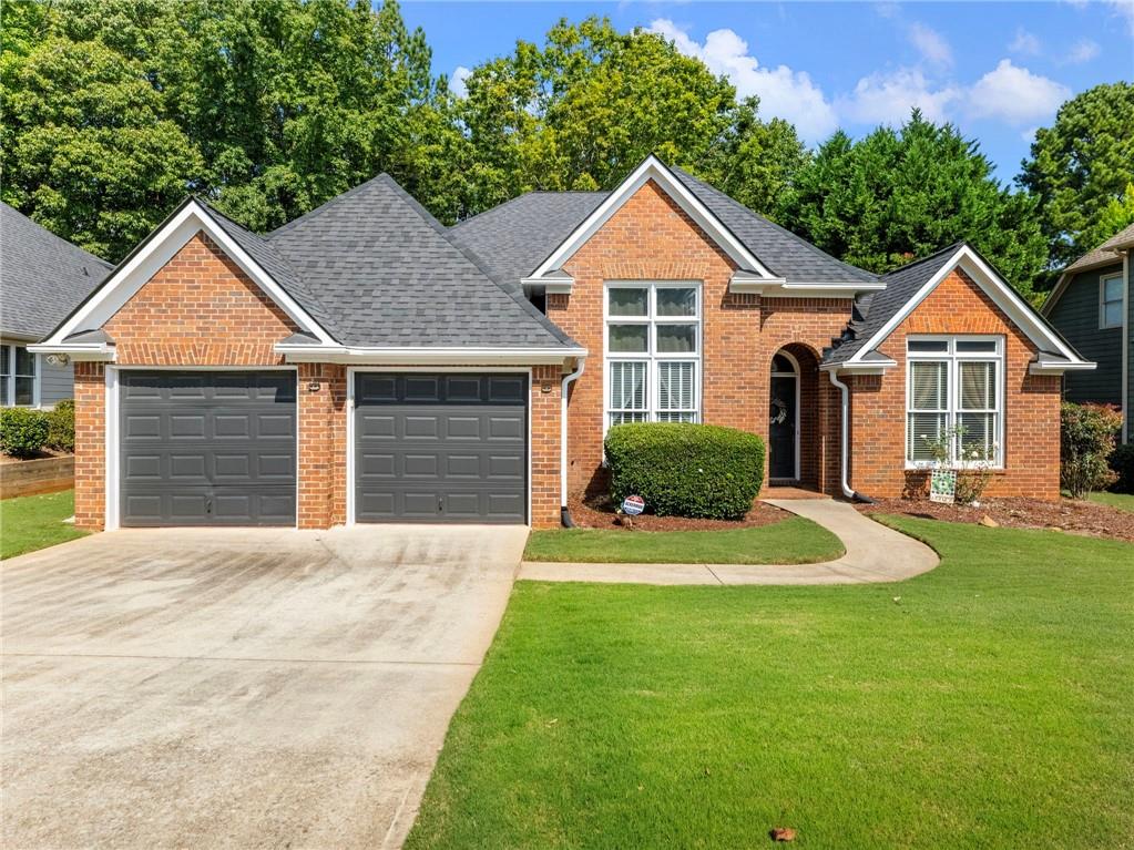 Welcome to this charming STEPLESS BRICK RANCH perfectly positioned on the 18th fairway in the highly sought-after Riverside at Apalachee Farms community. Offering resort-style amenities, this vibrant neighborhood features a driving range, golf course, clubhouse, multiple pools, one with a slide and shallow area for little swimmers, multiple tennis and pickleball courts, fitness center, playground, pavilion, walking trails, and more. Reputable schools, and plenty of parks and recreational facilities nearby. Conveniently located just minutes from shopping, dining, and year-round entertainment, this home delivers the perfect balance of relaxation and accessibility. The home boasts fresh exterior paint, LEAF GUARD GUTTER SYSTEM, two-car, separate-door garage, and a welcoming covered front entry. Step inside to a spacious foyer flanked by a vaulted formal living room (currently being used as a home office) and a large formal dining room, both with French doors for an elegant touch. At the heart of the home, you’ll find a bright, open layout complete with a family room, cozy fireplace, and an additional dining area. Well-designed kitchen is equipped with refinished cabinetry, breakfast bar, island, pantry, and ample counter space. The laundry room offers added convenience with a wash sink. The SPLIT-BEDROOM FLOOR PLAN provides privacy, with the spacious primary suite on one side featuring a double vanity, jetted soaking tub, and walk-in shower. Two additional secondary bedrooms and a full bath are located on the opposite side of the home, perfect for family or guests. Enjoy outdoor living in the fully fenced backyard, complete with a patio, shade trees, and a wooded backdrop for a peaceful, private feel. With no rear neighbors and seasonal views of the golf course, it’s an ideal setting for relaxation and entertaining. Additional highlights include a newer retaining wall, and a stepping stone walkway from the driveway to the backyard. This home offers great bones and an effortless layout, serving as a blank slate ready for you to update and customize to suit your lifestyle. Experience the ultimate combination of location, community, and potential in one of the area’s most desirable neighborhoods.