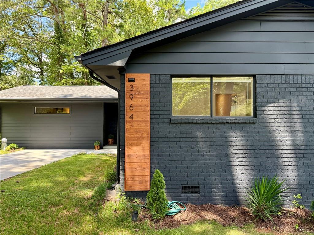 BUYER INCENTIVE! Seller is offering $10,000 toward buyer’s closing costs with an accepted offer. Credit can be applied to closing costs or used toward a mortgage rate buy-down to help reduce monthly payments. 3964 Gretna Green Drive, a beautifully remodeled 4 bedroom, 2 bathroom home nestled in Atlanta's vibrant Glenwood estates neighborhood. This home boasts an expansive floor plan providing ample room for relaxation and entertainment. 2025 renovations included, new roof, new A/C, new hardwood flooring, new LED lighting, new updated kitchen with new cabinetry, quartz counters, new SS appliances, updated bathrooms with new vanities, luxurious showers and interior and exterior painting. Freshly landscaped front yard with private fenced in backyard and deck/patio area. Within minutes of popular dining neighborhoods in Kirkwood, Oakhurst, downtown Decatur and Dekalb Farmers Market. Super convenient location near major interstates and less than 20 minute commute to Hartsfield-Jackson International Airport. Experience the perfect blend of modern updates and urban convenience at 3964 Gretna Green, a place to call home.