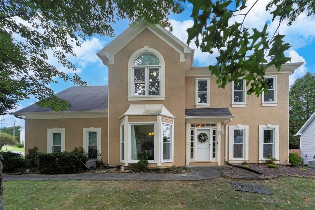 Welcome to this beautifully updated 4 bedroom, 2.5 bathroom home on a corner lot in the heart of Johns Creek, located in a top-rated school district. Featuring a stucco exterior and numerous recent upgrades, this home is truly move-in ready. The bright two-story foyer leads to a formal living room, dining room, and a cozy family room that opens to the kitchen – perfect for everyday living. The kitchen overlooks the family room and leads directly to the fenced-in, level backyard, ideal for entertaining and outdoor enjoyment. Upstairs, the primary suite offers a fully renovated bathroom with modern finishes, along with three additional bedrooms and a shared full bath. Enjoy peace of mind with new luxury vinyl plank (LVP) flooring, new front and back doors, newer energy-efficient windows with a lifetime warranty, HVAC systems with a lifetime transferable warranty, a new water heater, and a newer electrical panel. All of this in a prime location, just minutes from Johns Creek's best restaurants, parks, shopping, and more, and only 8 minutes from Avalon and GA-400!