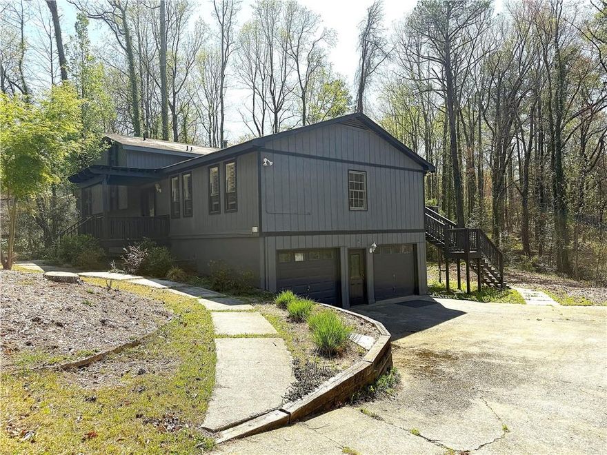 Discover your opportunity to live in East Cobb with this charming split-level home boasting 4 bedrooms and 3 bathrooms. Embrace the chance to customize and elevate this space into your dream home with the help of your contractor. The open floor plan includes a formal dining and living room, an updated kitchen perfect for entertaining, and a spacious family room with a fireplace. Enjoy modern comforts like an updated primary bathroom, a jetted garden tub in the hall bath, and a convenient walk-in style shower in the lower level. The lower-level game room opens to the backyard through sliding glass doors, while the garage and laundry room offer easy access with side-entry doors. This functional home is ideal for multi-generational families or guests seeking privacy, near the Mountain View Aquatic Center, shopping, restaurants, and more. Take advantage of no HOA fees and no rent restrictions, with an optional swim/tennis/playground at the rear of the neighborhood.