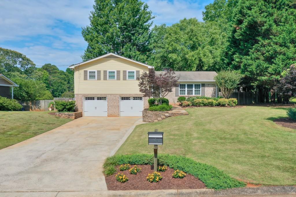 This Immaculately Maintained home with Backyard Pool Oasis is conveniently located to Shopping, Dining, Great schools and interstate access! The Main living area features a Gorgeous Brick fireplace that is the Focal point for the Dining and Living room areas and opens onto the huge Screened in Porch! Upstairs the Three Bedrooms have all New carpet, and 2 updated bathrooms! Heading out to the Back Yard, the Screened in Porch is the most Relaxing place to enjoy a Nice evening or have a Grill out on the extended Back deck! The luscious landscaping that surrounds the Inground Pool makes you feel like you are on Vacation everyday! There are too many features to mention including Freshly Painted Decking, New HVAC, Windows Replaced, and more! This Home is Perfect as it is!