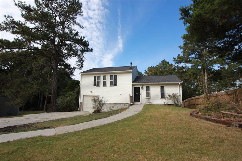 This recently renovated tri-level home features an updated kitchen with a granite island and countertops; and a tile backsplash. The kitchen also features an eating area overlooking the Great Room, with a vaulted ceiling. The home features hardwood flooring on the main level, lower level and stairs; ceramic tile in the bathrooms and carpet in the upper level 3 bedrooms. The Master Bedroom sits on the lower level and has a beautiful fireplace and a private bathroom. There are 3 bedrooms and 1.5 bathrooms on the upper level. In the backyard sits a newly installed salt water jacuzzi pool and patio, which is perfect for gatherings with family and friends. The Garage features a corner shower. The Roof, Furnace, Hot Water Heater, and A/C Unit have been replaced within the past 4 years.garage door just be replaced with new one in last month. Great Location - Approximately 10-15 minutes from Hartsfield-Jackson International Airport.listing agent is the owner,thank you!