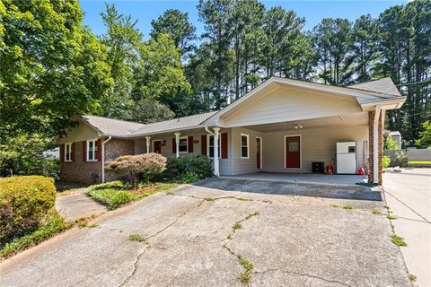 Photo of 824 Hickory Ridge Road SW, Lilburn, GA 30047 (MLS # 7659816)