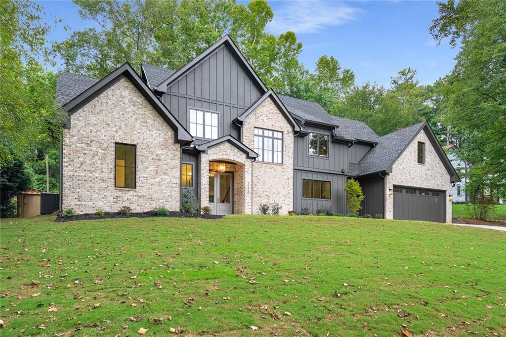 Luxury new construction dream home in Wheeler District- highly regarded for its STEM Magnet program. PRIME location- just minutes from freeway access! Inside, you’ll be greeted with elegance and thoughful design. The living room features a sophisticated plaster fireplace. You will notice high-end fixtures throughtout the home. The kitchen impresses with an abundance of cabinetry, gas range, and a plaster range hood- integrating the living room and kitchen design. Sparkling tile in the kitchen sorrounds the wood framed windows and elevates the tree-line views above the kitchen sink. Walk in pantry provides a dedicated space for small appliances, keeping countertops clear for an organized home. The peaceful backyard is the star of the home here- two covered back porches with a cozy brick fireplace for these upcoming relaxing fall evenings. Flat fully fenced backyard with mature trees for shade. Hookups on the patio give options for an outdoor kitchen. The main level offers a tranquil primary suite, complete with a spa-inspired soaking tub and shower. Additionally, the main level has a guest suite (or mini primary suite) with a stand up shower and walk in closet. Upstairs, each bedroom has a walk in closet, and connects to its own private bathroom with a stand up shower with high-end tile. Down the hall, you’ll come upon a stylish sitting area and an expansive bonus room- providing flexible space for a media lounge, home office, or use it as an additional bedroom. This home is equipped with a tankless water heater, front and back irrigation, and a deep garage designed to accommodate 4 vehicles or provide bonus workshop space. Nearby private schools- Mt Bethel and Eastside Christian schools are only a mile away, adding to the home’s exceptional conveniece. Schedule a showing today! This home is completed and ready to be yours.