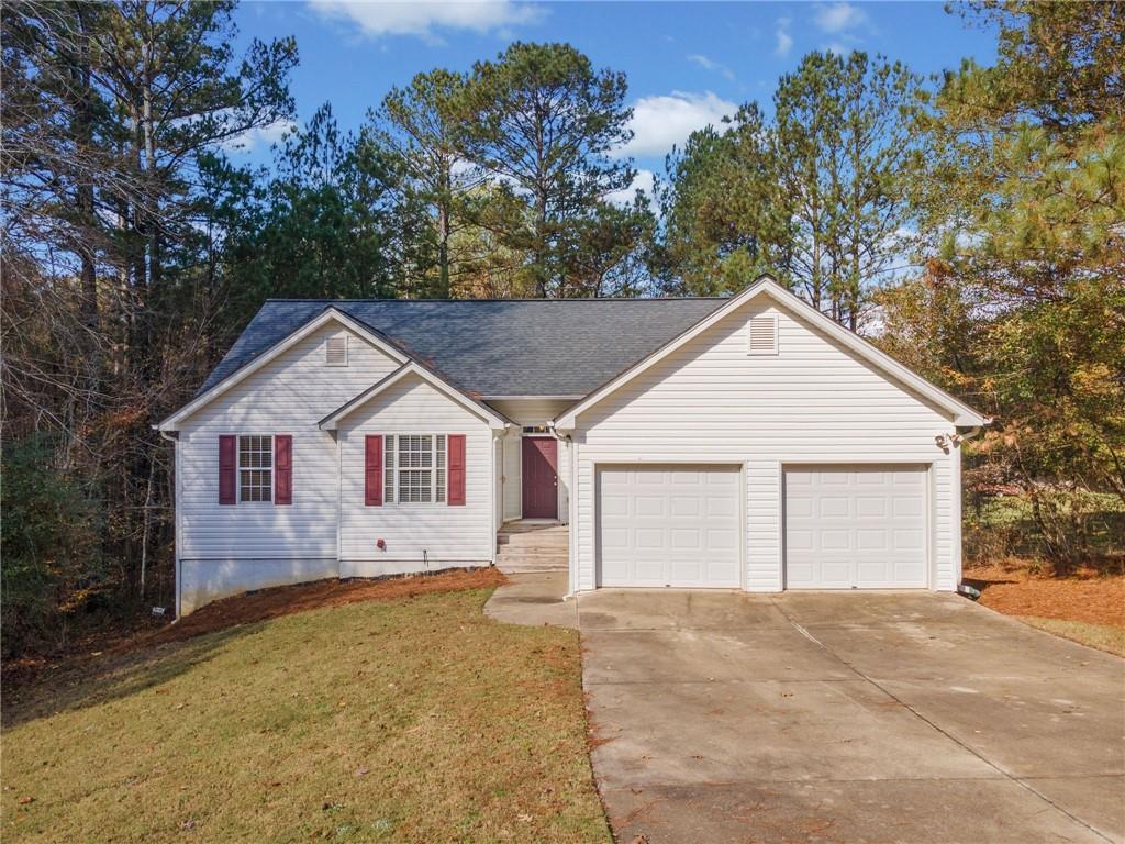 Welcome to 8030 River Chase Drive, this charming 3-bedroom, 2-bath ranch with an unfinished basement with a boat door in sought-after Forsyth County! This move-in ready home features hardwood floors and an updated kitchen. Enjoy the serenity of the private, wooded yard, perfect for relaxing or entertaining. The extended driveway provides ample parking for multiple vehicles. The unfinished basement offers endless possibilities for customization to suit your needs. Conveniently located near schools, shopping, and more. Don’t miss this opportunity—schedule your showing today!